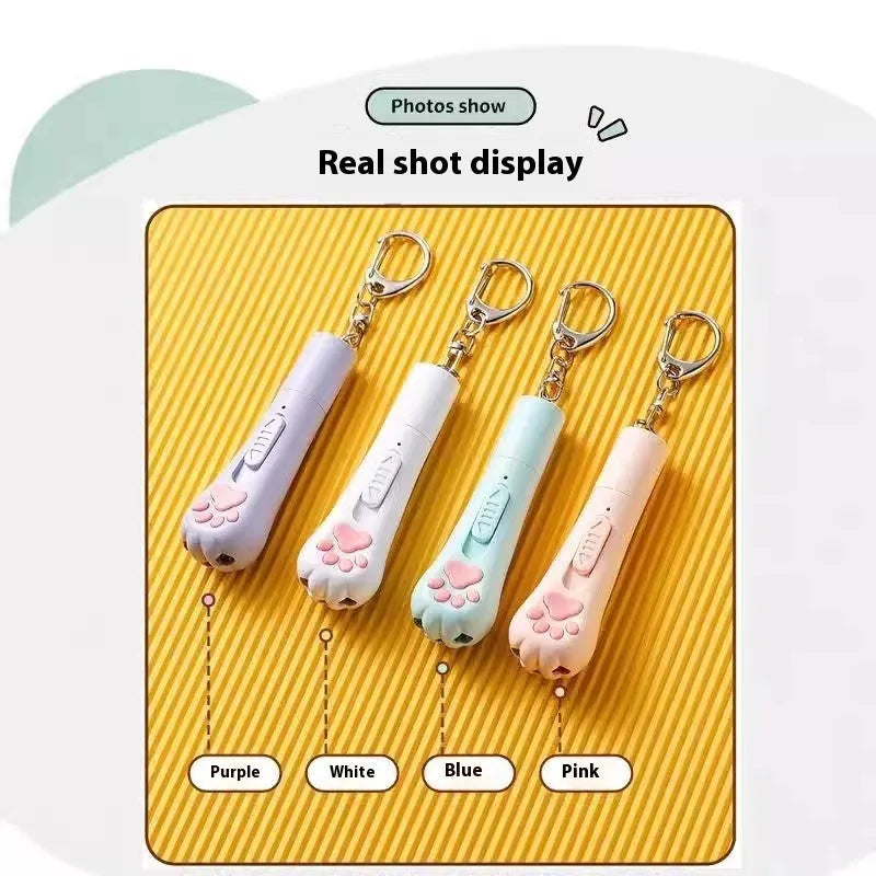 Rechargeable self-moving cat teaser toy in cream white colour with USB charging cable