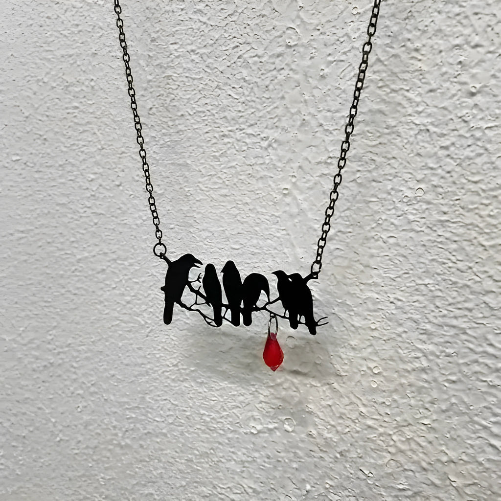Black electroplated alloy crow necklace with cross chain design and zodiac elements