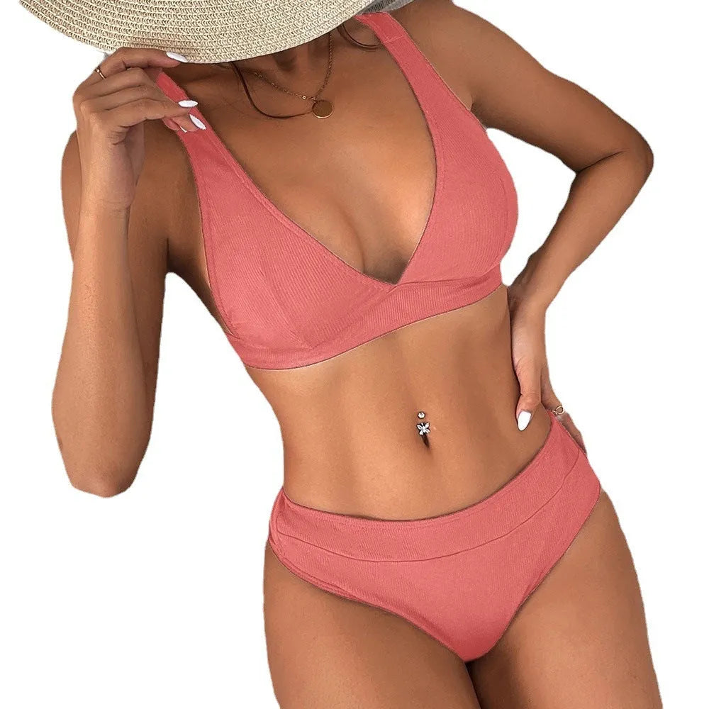 Women's black lace-up front split bikini swimsuit on a mannequin.