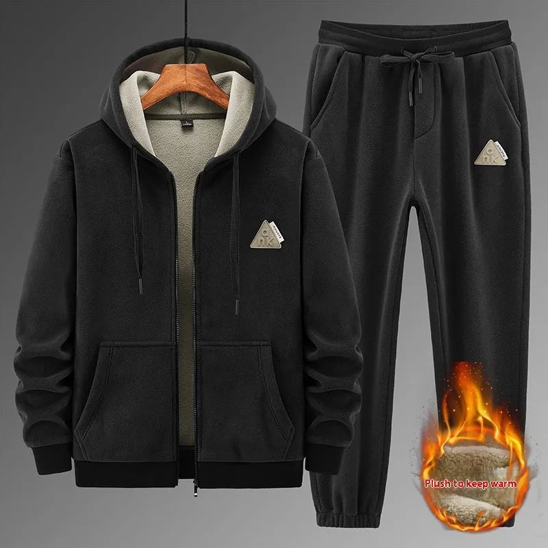 Casual sports suit consisting of a grey cashmere hooded sweater and matching cotton trousers.