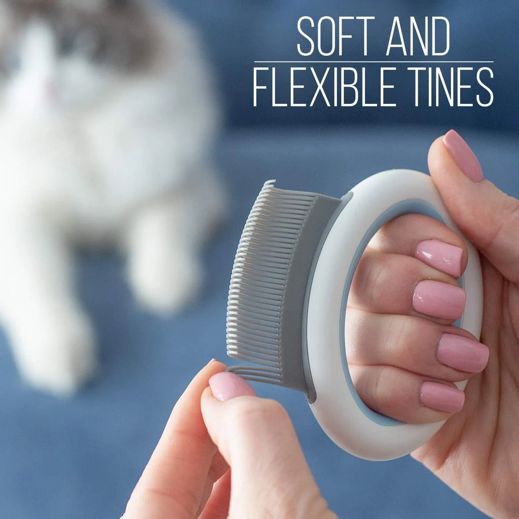 Blue pet grooming comb for deshedding and dematting cat and dog hair on a white background.