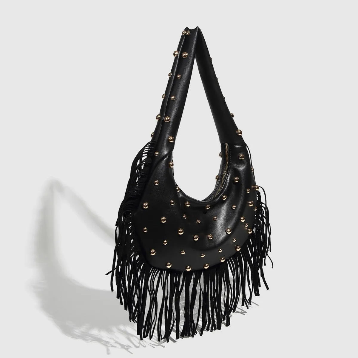 Retro black shoulder handbag with a long tassel and a wine red colour option, shown with internal phone pocket.