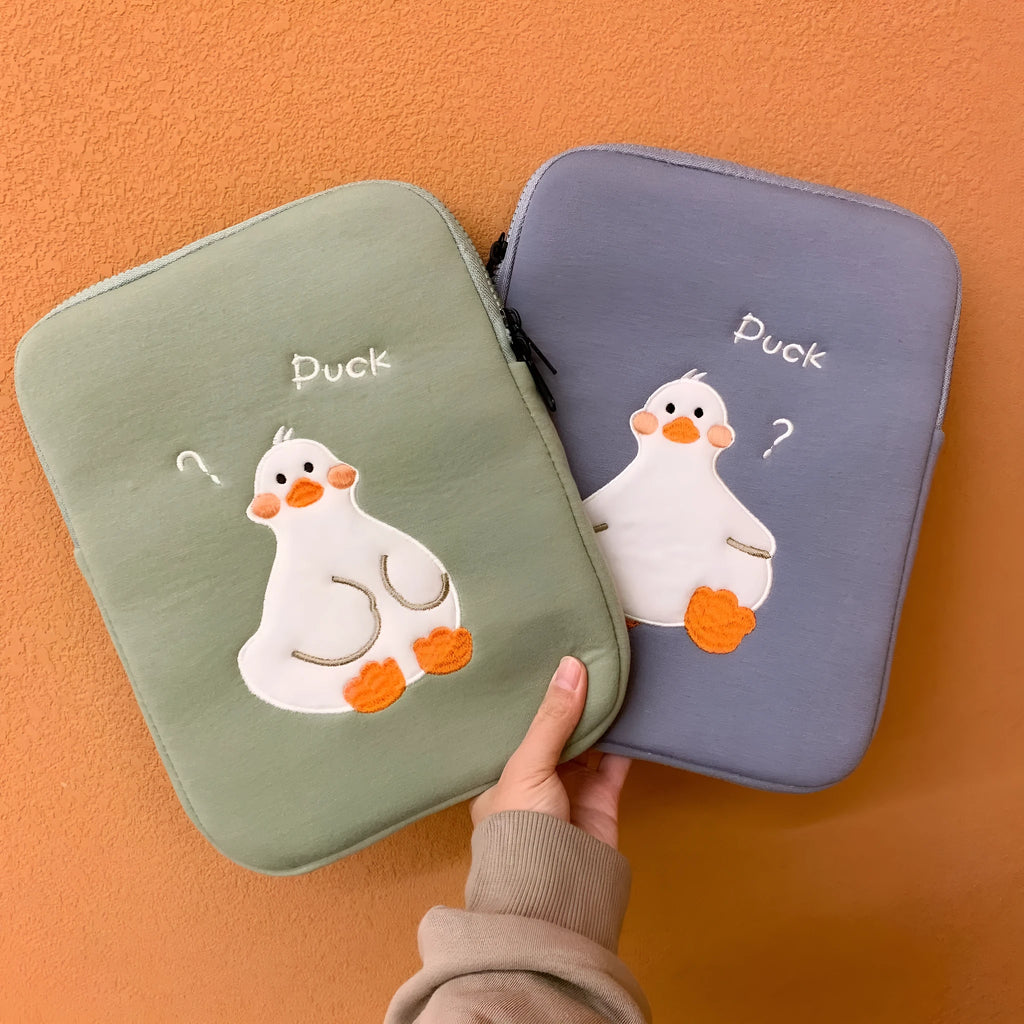 Blue cotton tablet case with cartoon duck embroidery and a zip closure, sized for an 11-inch tablet.