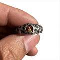 Hand-forged copper Grotto Buddha ring with rock texture finish showing size 8