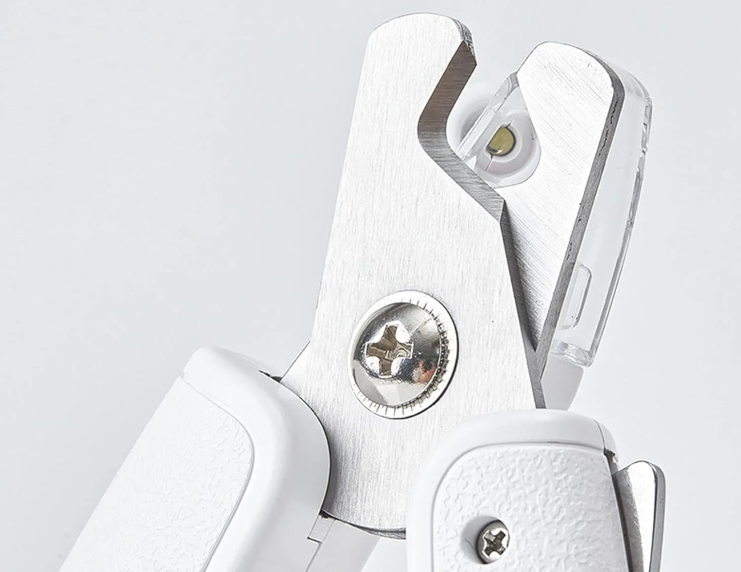 White pet nail clipper with LED light on handle and transparent anti-splash guard surrounding the blades.