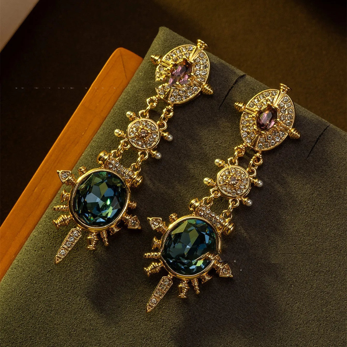 Geometric gold coloured retro stud earrings with round design elements on alloy stud backs