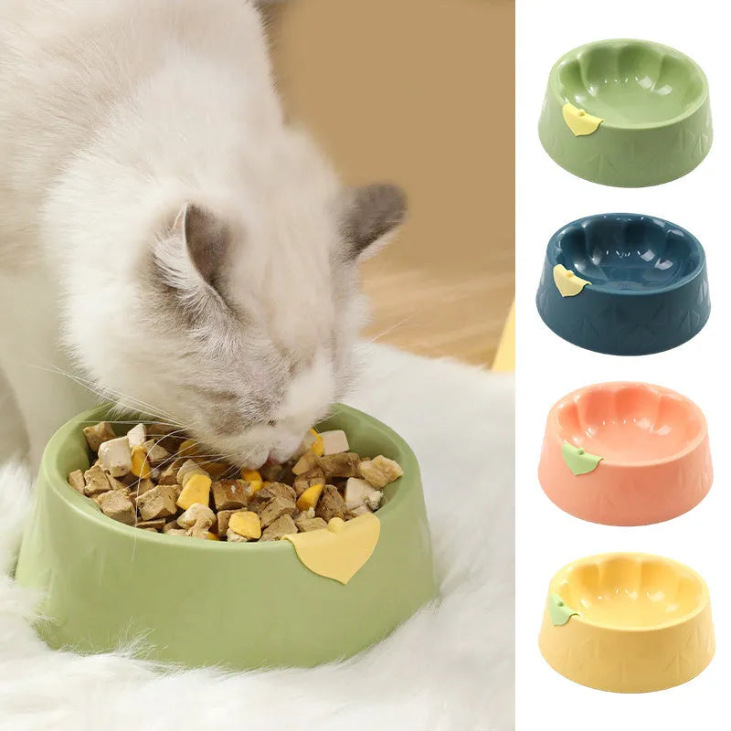 Green plastic flower-shaped double pet bowl for food and water on a white background.