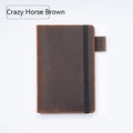 Handmade old-fashioned kraft notebook with cowhide cover, open to show wood-free paper pages.