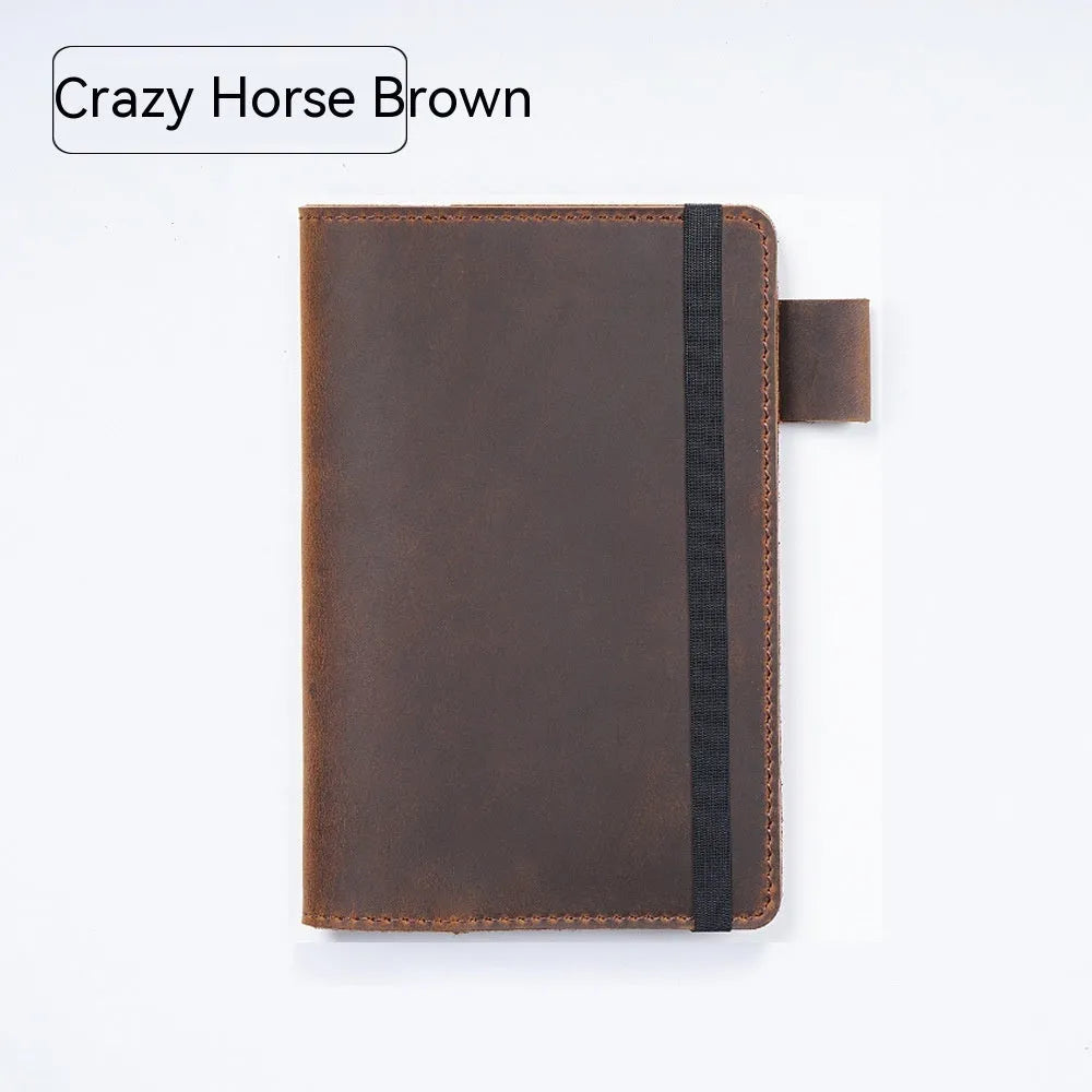 Handmade old-fashioned kraft notebook with cowhide cover, open to show wood-free paper pages.