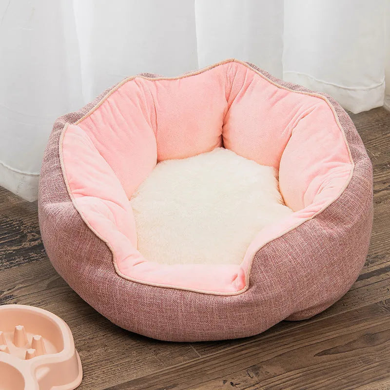 Octagonal grey pet bed with soft padded rim and removable inner mat for a small dog