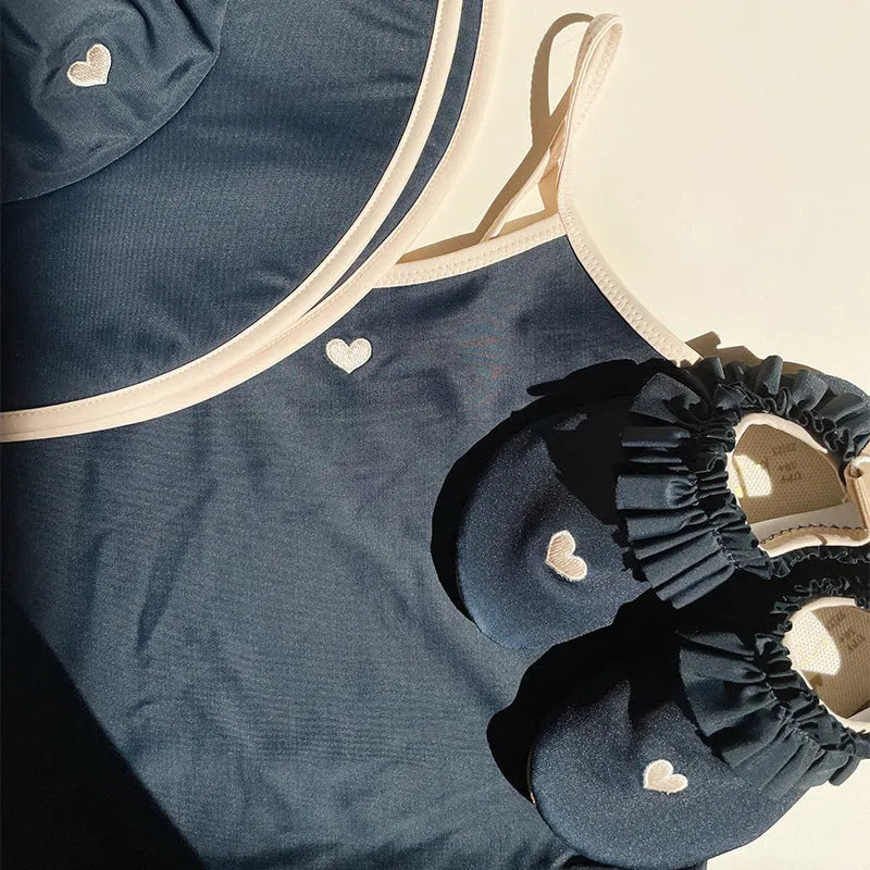 Dark blue split girl's swimsuit with briefs-style design for swimming and wading activities