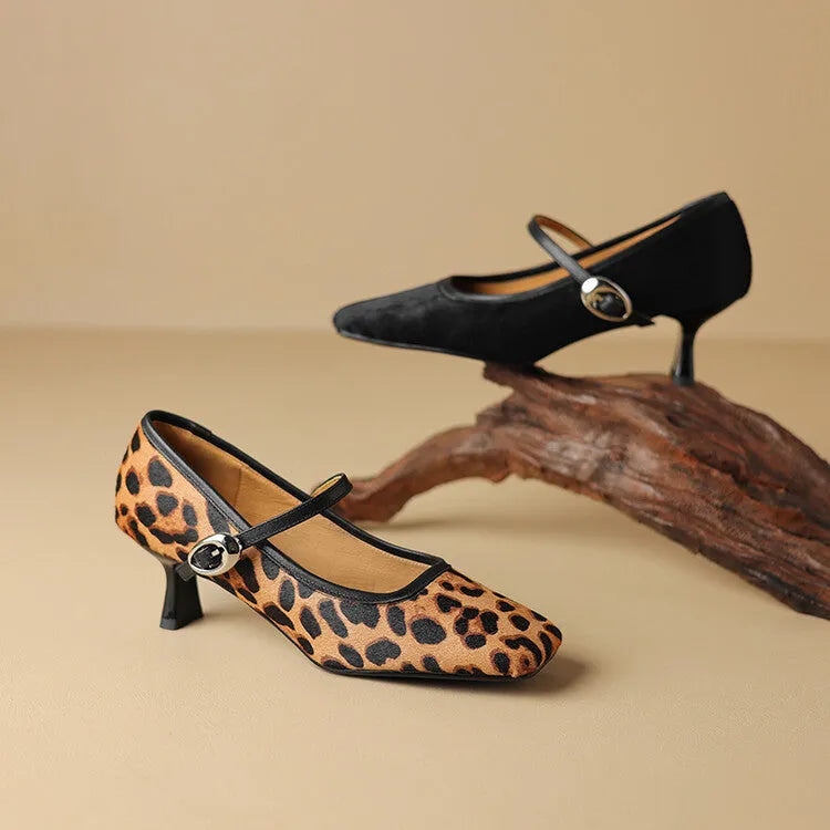Women's black square toe stiletto ankle-strap high heels with horse hair upper shown from side angle