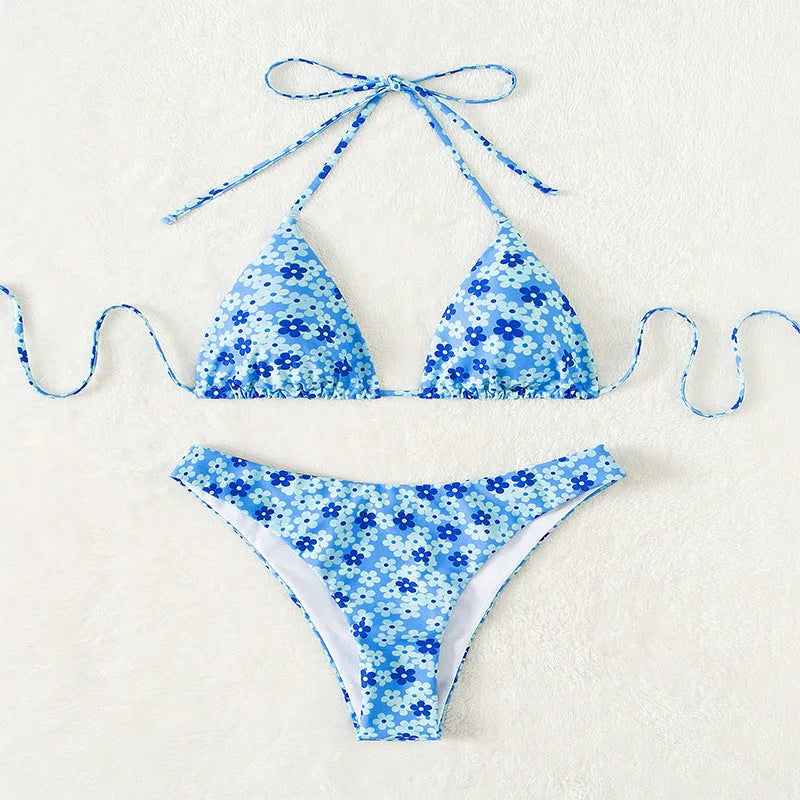 Women's blue floral swimsuit set with lace-up front and high-leg shorts