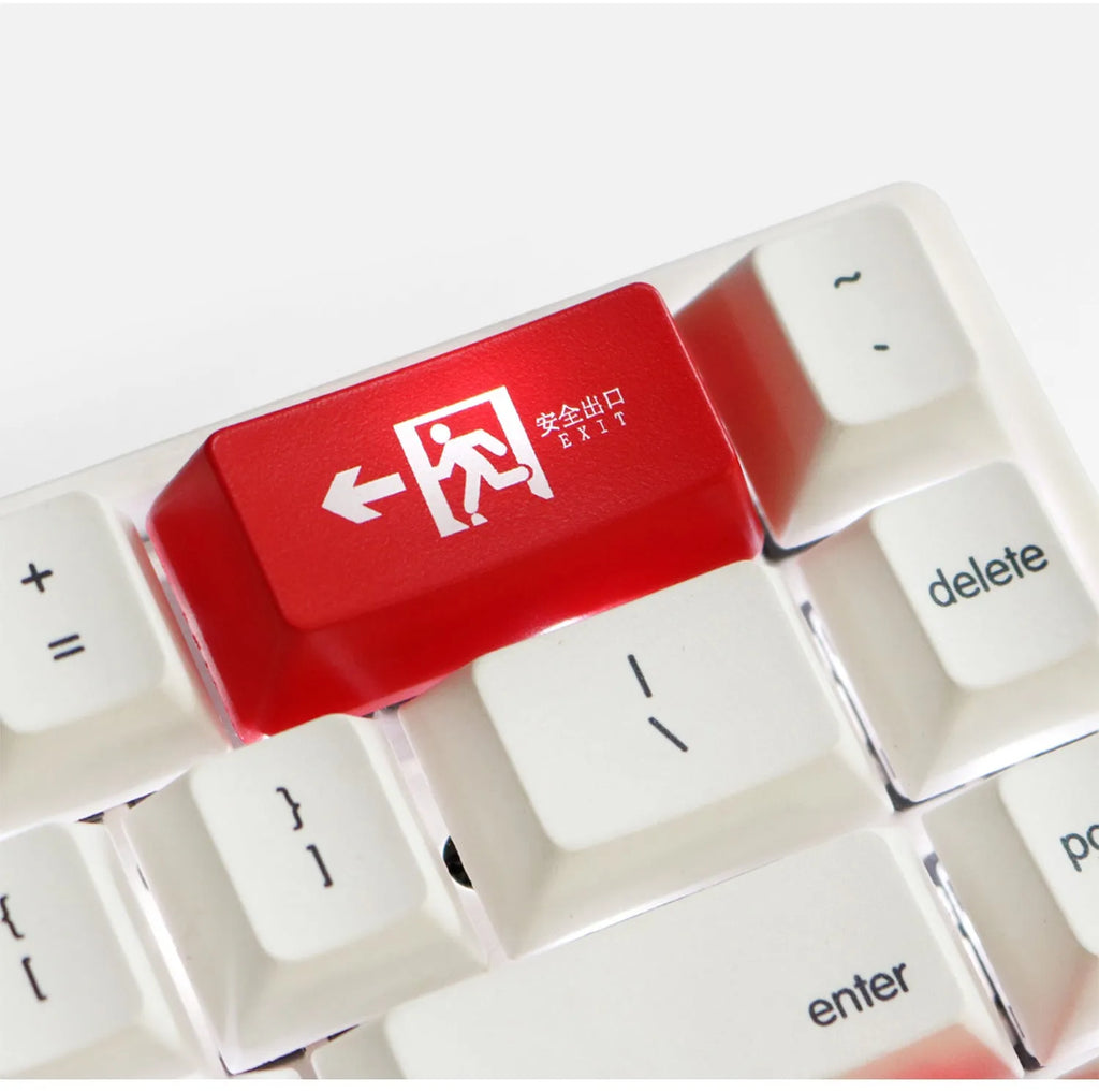 Transparent mechanical keyboard keycap with safety evacuation exit graphic in red text