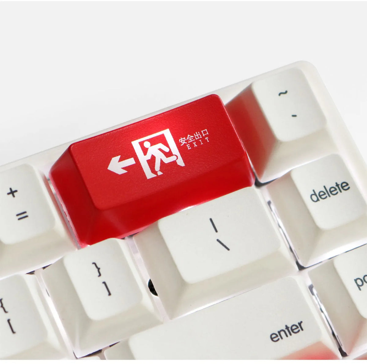 Transparent mechanical keyboard keycap with safety evacuation exit graphic in red text