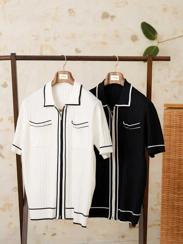 Slim-fitting black short-sleeved polo shirt with a lapel collar, made from a knitted viscose and polyester fabric blend.