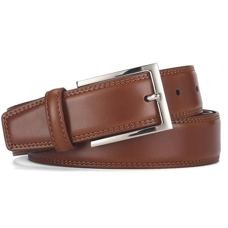 Men's black leather belt with a silver alloy pin buckle on a wooden background.