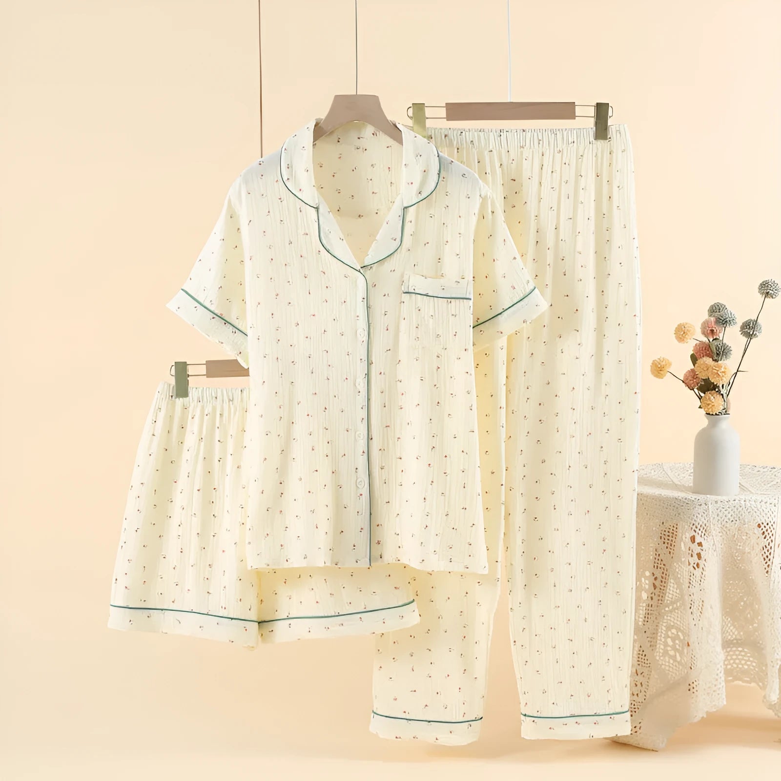 Women's garden gold cotton crepe gauze three-piece pyjama set with lapel collar and three-quarter sleeves.