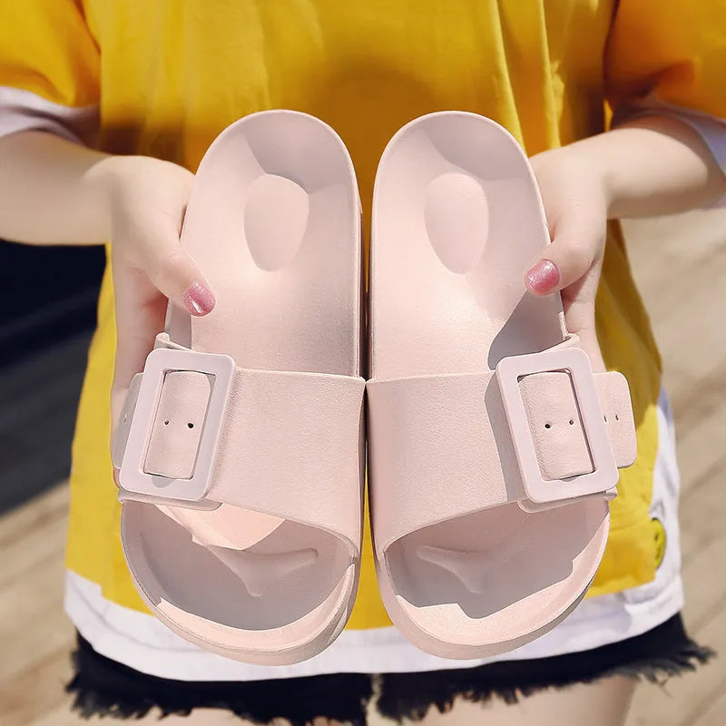 Women's grey blue buckle flip-flop with soft EVA sole and adjustable strap.