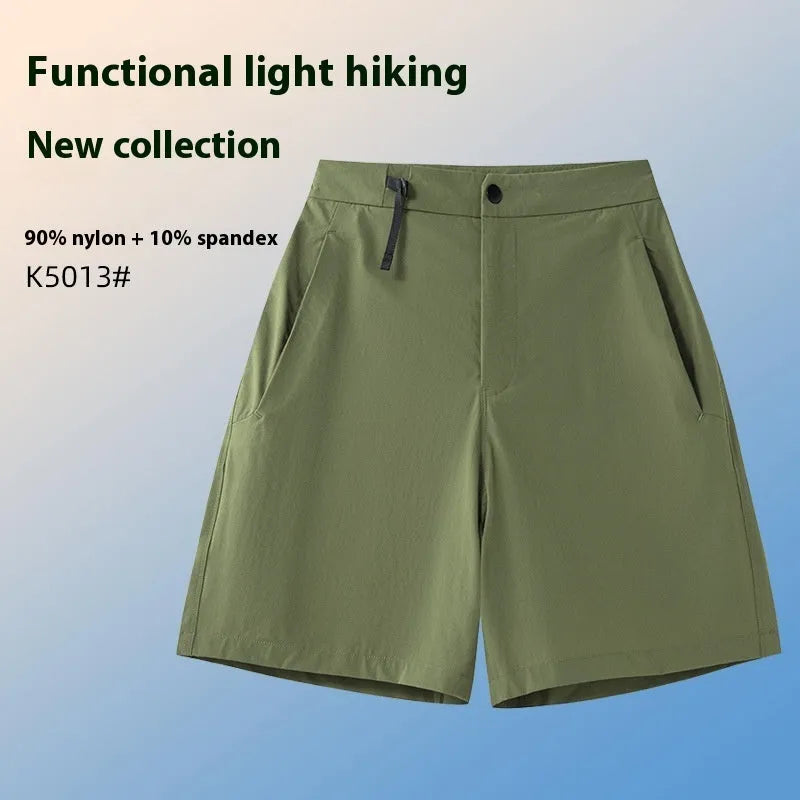Man wearing khaki quick-drying sports shorts with an elastic waistband for running or climbing.