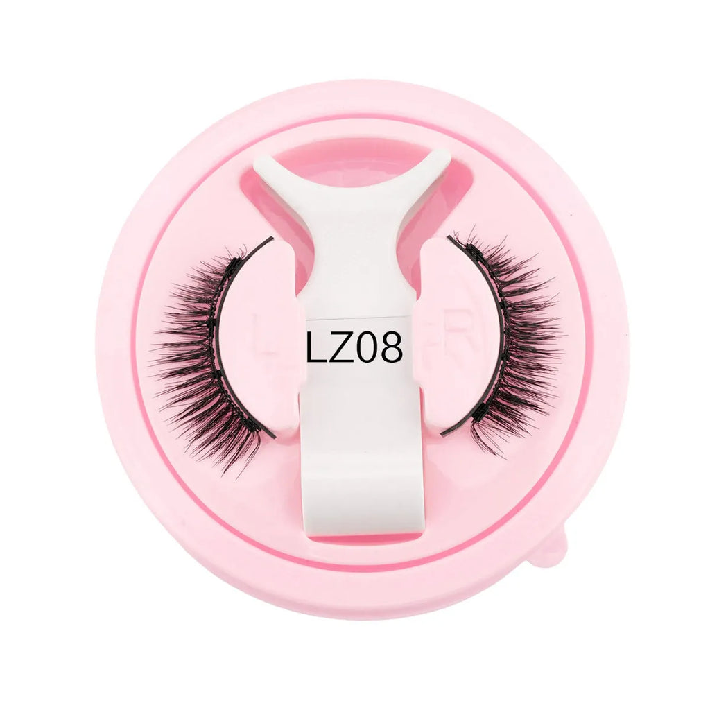 Set of reusable, glue-free false eyelashes in a natural thick style made from artificial fibre.
