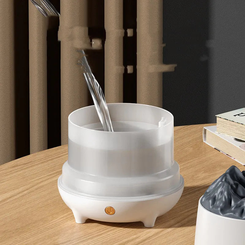 Volcano-shaped ultrasonic humidifier with USB cable on wooden surface