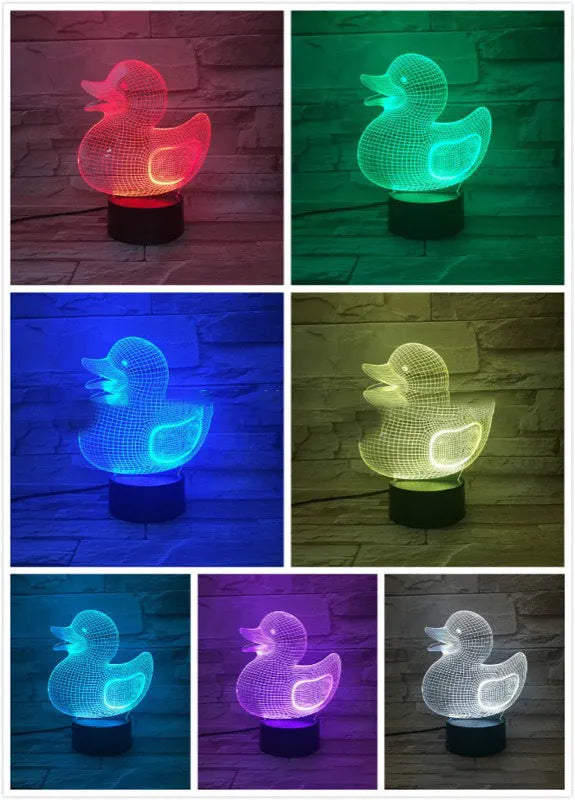 Little yellow duck 3D night light with remote control on a bedside table, showing colour change