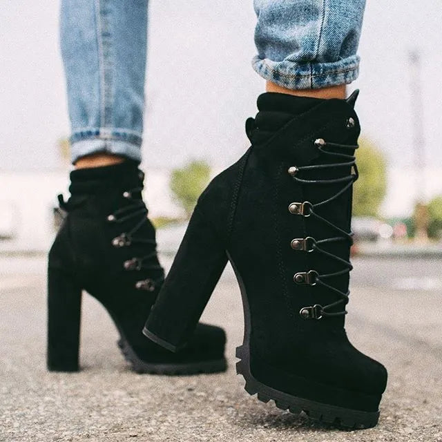 Women's suede ankle boots with thick heels, buckle straps, and rivet details in four colour options