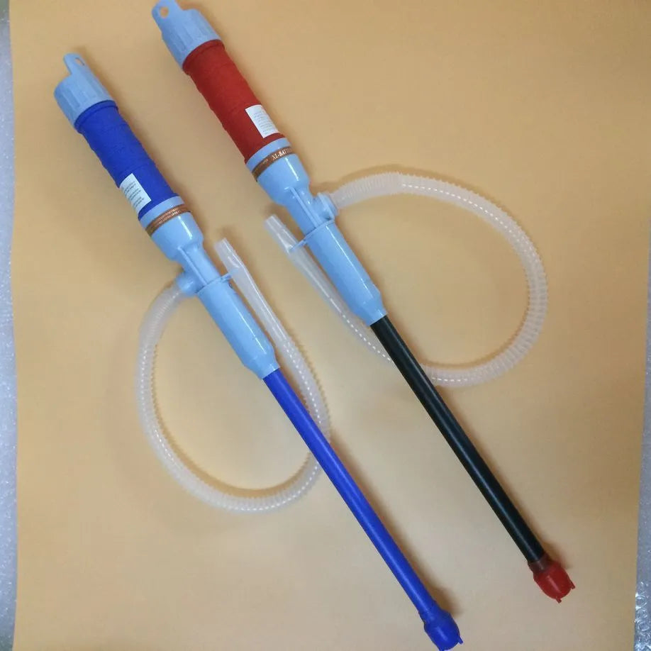 Manual hand-operated siphon pump with blue flexible tubing for transferring gasoline and oil.