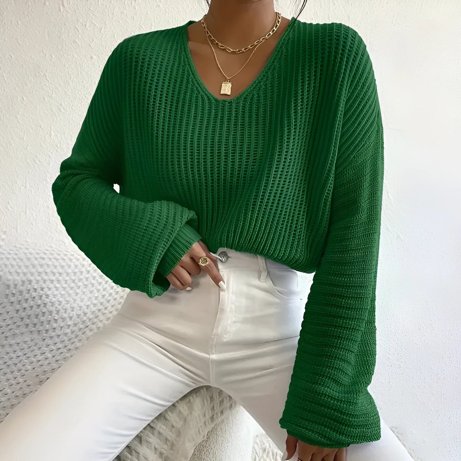 Women's solid colour long sleeve polyester pullover jumper in a loose casual fit.