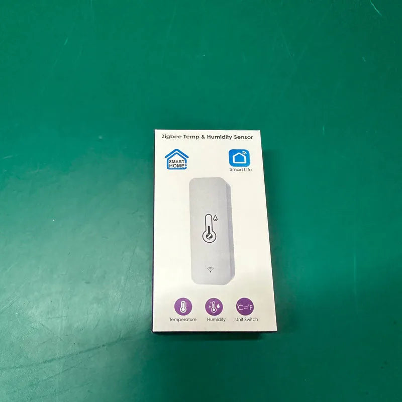 Compact white ABS plastic WiFi temperature and humidity sensor with measurement display