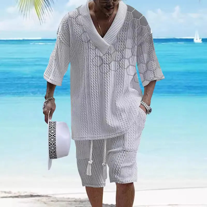 Man wearing a printed drop-shoulder knitted short-sleeve top with matching shorts, a casual summer suit set.