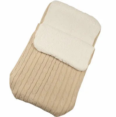 Envelope-style baby stroller sleeping bag in beige colour showing thick cotton wool filling and soft lining.
