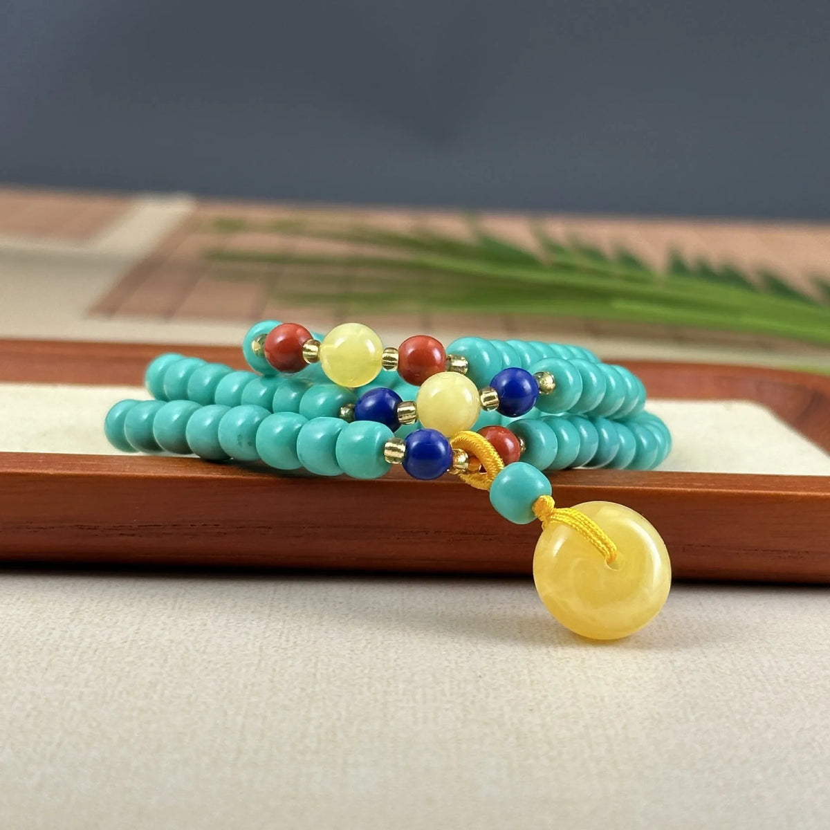 Turquoise mesh flower lucky pendant on ball bead chain necklace, hand-woven construction
