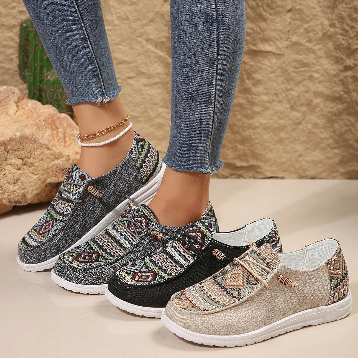 Women's black round toe low-top flat shoes with artificial PU upper and rubber sole on a white background