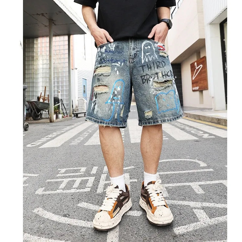 Blue men's ripped denim shorts with a straight leg cut and zip fly front.