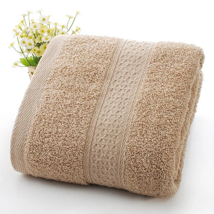 Thickened cotton blend bath and beach towel shown in multiple colour options including green, blue, and pink variations.