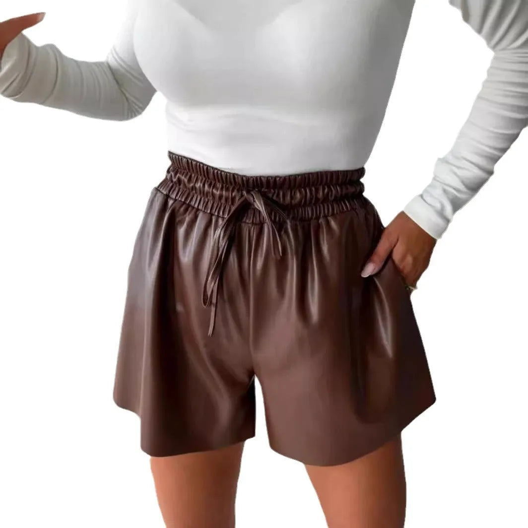 Black women's wide-leg shorts with a drawstring lace-up waist and straight-leg silhouette.