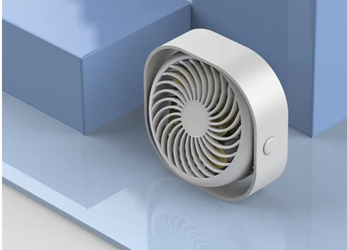 USB-powered desktop fan with alarm clock style in blue, pink, green, or white, showing 360-degree rotation.