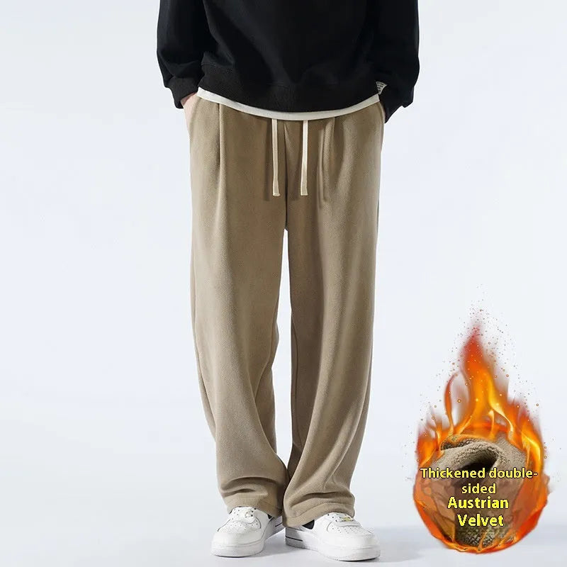 Men's apricot coloured loose-fit polar fleece winter trousers with a drawstring waist, shown flat.
