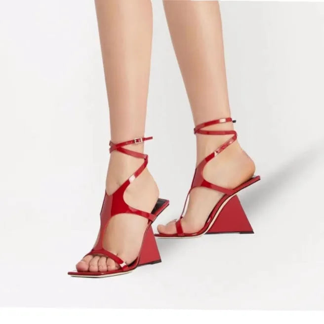 Women's black square-toe high heel sandals with a button fastening on a 9.5cm heel.