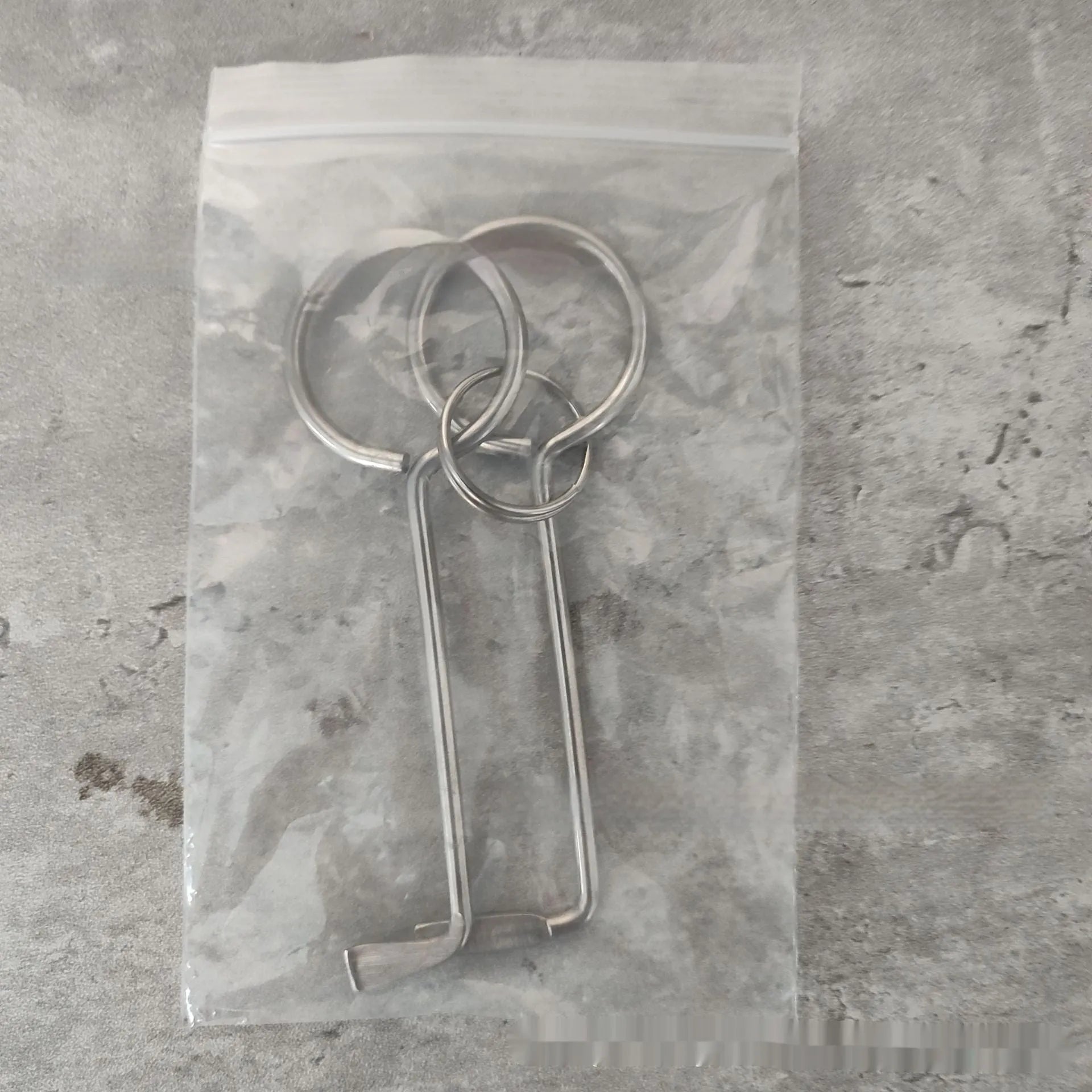 Two metal alloy wrench tools from a portable 2-piece set for household and vehicle maintenance.