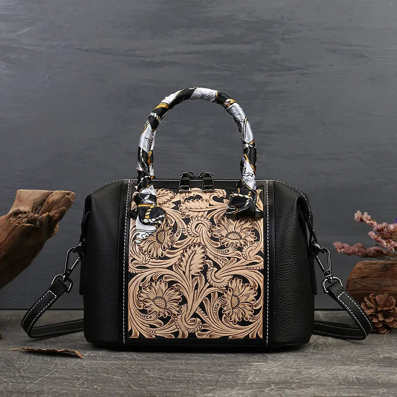 Vintage-style genuine leather messenger bag in black, showing internal zipper and phone pockets.