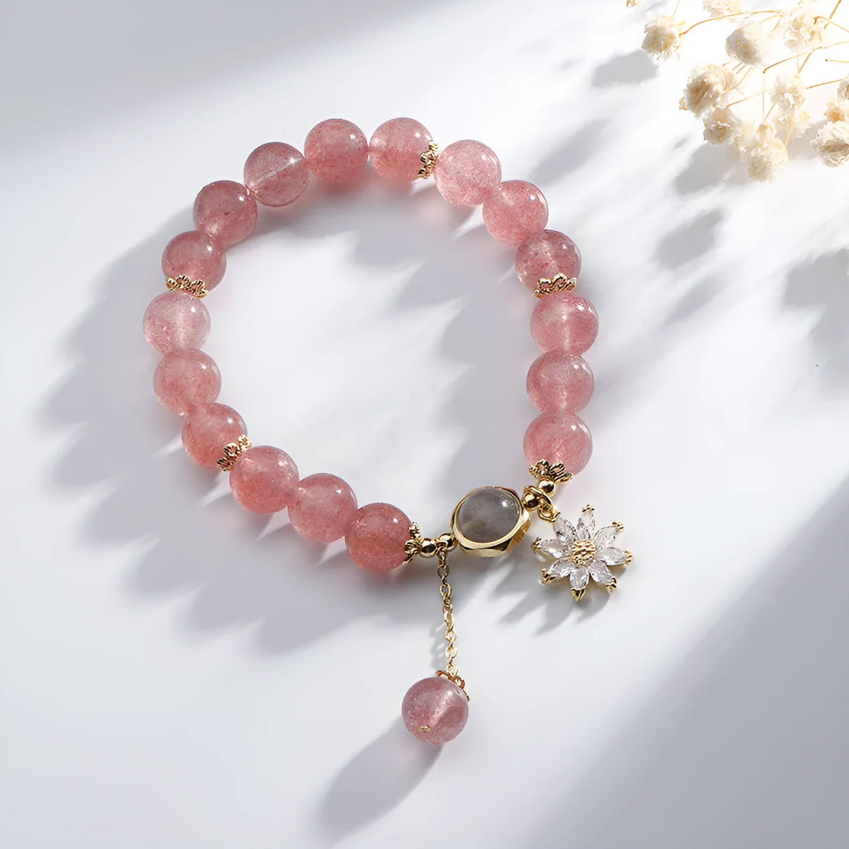 Strawberry quartz crystal bracelet with electroplated flower pendant in Mori style design