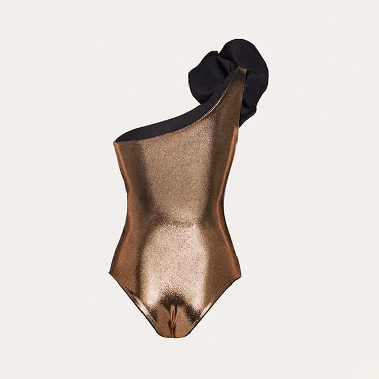 Gold coloured handmade halter neck one-piece swimsuit with hollow-out design on a mannequin.