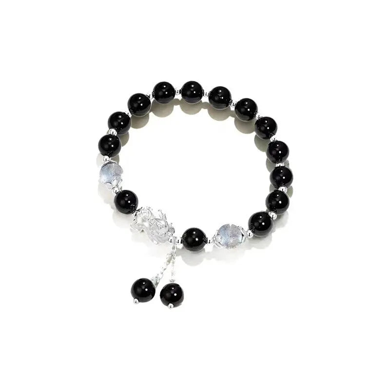 Natural black agate wave-shaped couple bracelet with money painting design on gray background