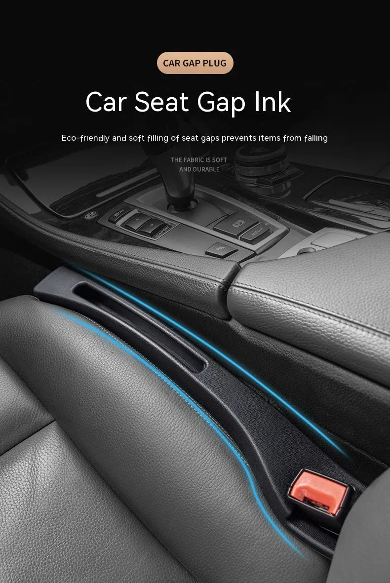 Black plastic car seat gap storage box with handle between vehicle seats
