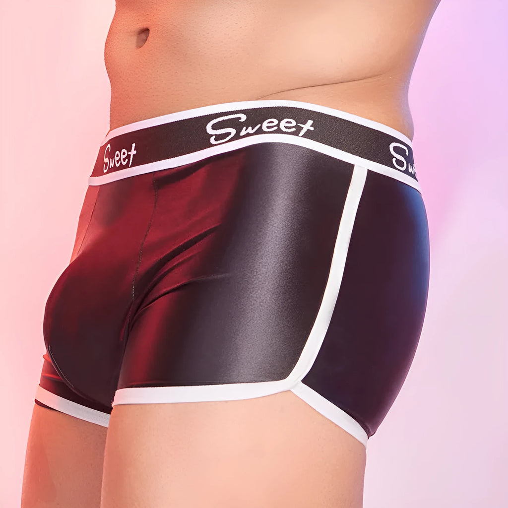 Man wearing shiny silky black nylon boxers, a pair of men's breathable underwear