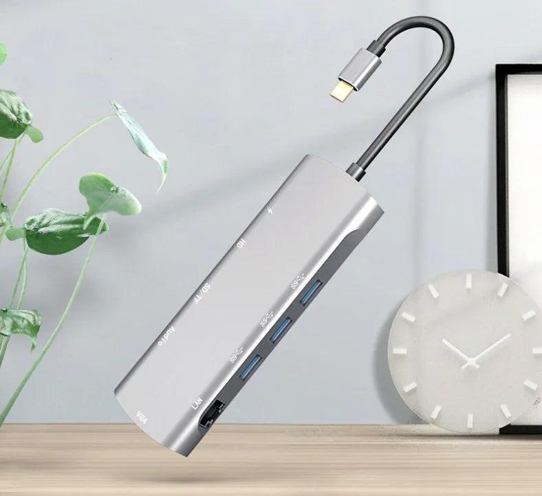 Grey USB C docking station with HDMI, VGA, and USB 3.0 ports for laptop connectivity