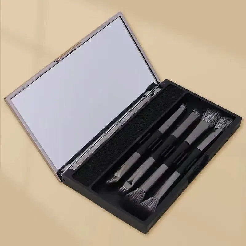 Makeup brush set with mirror case showing silver and gold brush options with artificial fibre hairs